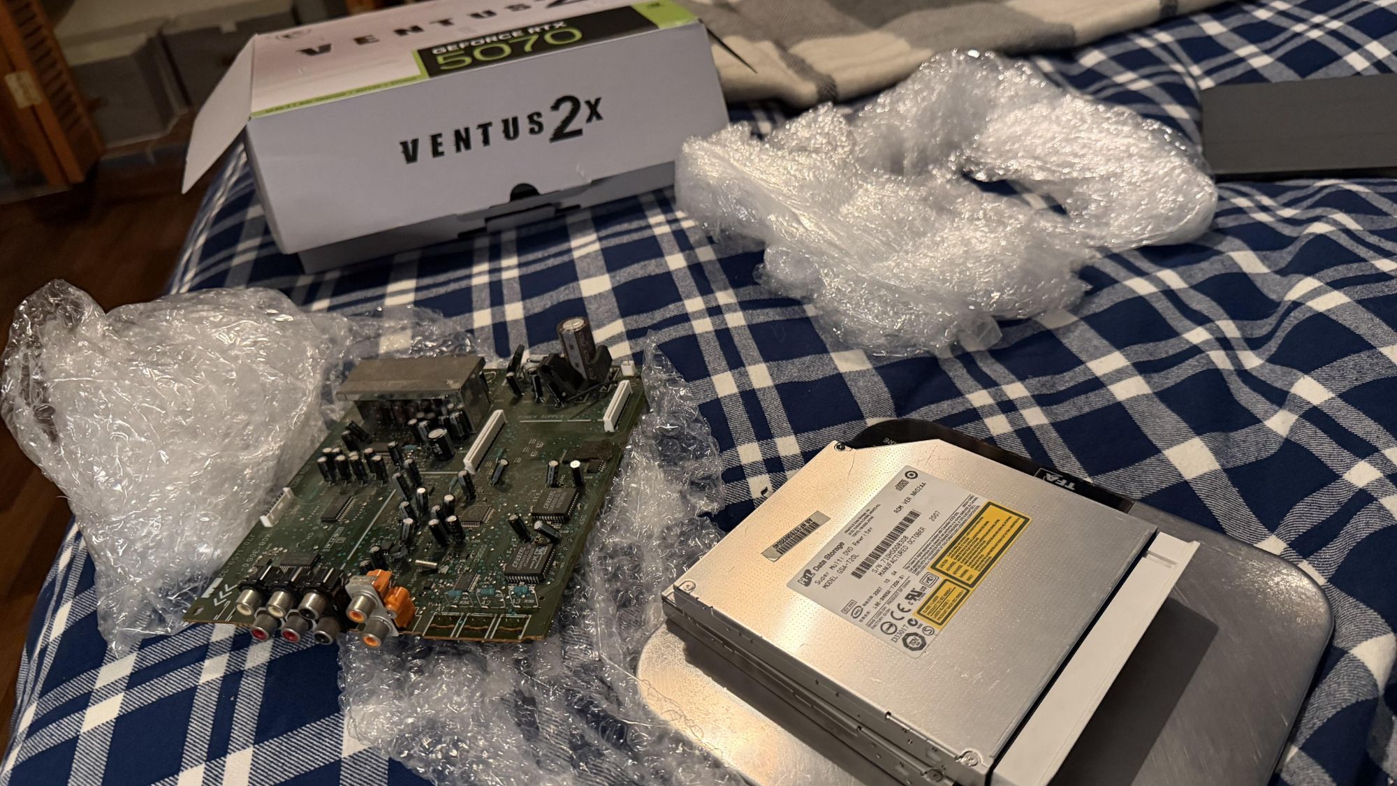Reference image for: Unlucky PC builder sent RTX 5070 from Amazon, gets DVD rewriter and a busted logic board from an early AV